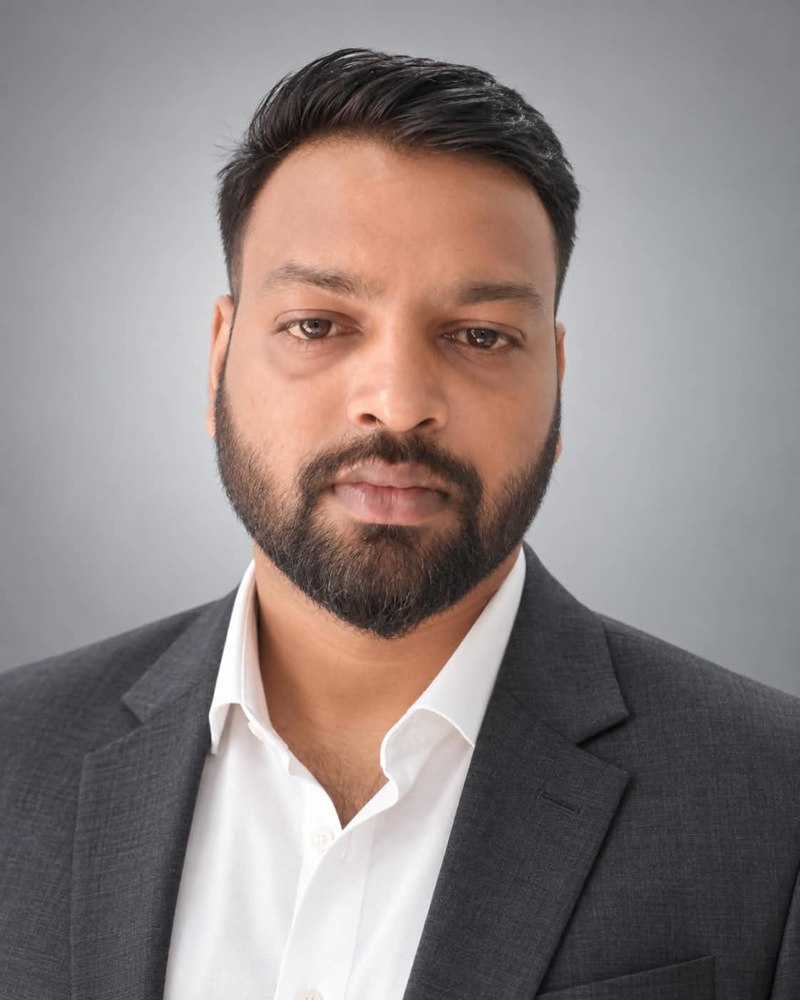 Founder portrait in charcoal blazer